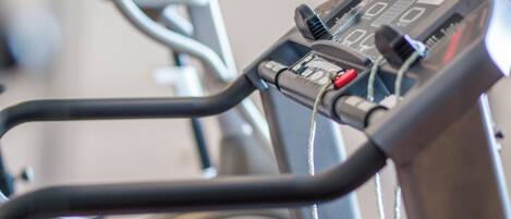 A stationary bike with a digital display and control panel.