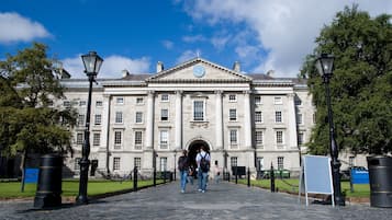 A historic building with a central entrance, large windows, and classical architecture.