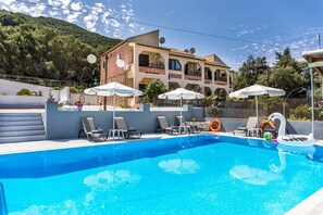 Outdoor pool, pool umbrellas, pool loungers