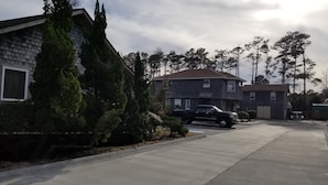 A residential area with houses, a driveway, and a parked truck.