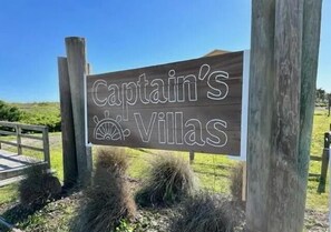 Property grounds - Seven Seas-7C - Great condo with community pool & tennis courts! (Holden Beach)