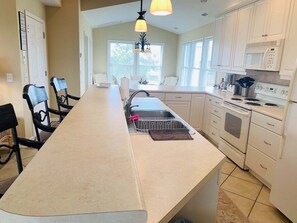 Fridge, microwave, oven, stovetop - Sandy Toes - Oceanfront 3BR home in Holden Beach, perfect for a family getaway. (Holden Beach)