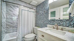 Combined shower/bathtub, hair dryer, towels, soap