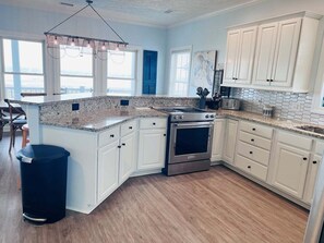 Fridge, microwave, oven, stovetop - Experience oceanfront luxury at Beaches be Crazy, Holden Beach, with 4 bedrooms and a private pool! (Holden Beach)