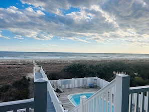 Relax by the pool overlooking the ocean from this elevated beachfront property.