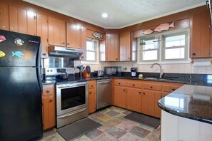 Fridge, microwave, oven, stovetop - Oceanfront 4-bedroom home at Holden Beach, perfect for fun and relaxation. (Holden Beach)