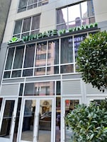 A building with a sign reading "WINGATE BY WINPHAM".