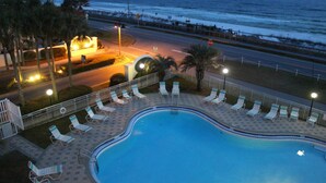 A swimming pool with lounge chairs and a view of the ocean. - PET FRIENDLY, Private Beach Access, Beach Setup, Pools, HotTub, Tennis/Pickleball, Maravilla 1st Fl (Miramar Beach)