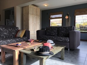 Exclusive Chalet, 2 Bedrooms, Mountain View | Living area | Flat-screen TV