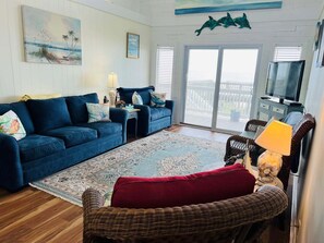 TV - Seaside: Spacious 4BR oceanfront home in Holden Beach, perfect for 12 guests. (Holden Beach)