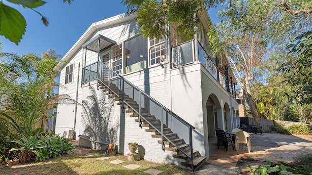 A two-story house with a staircase leading to the upper floor. - Shoal Bay Avenue 2 close to Beach (Shoal Bay)