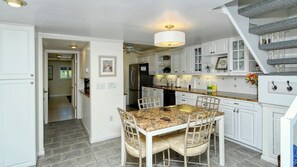 Enjoy cooking in this well-equipped kitchen with an oven, refrigerator, and sink.