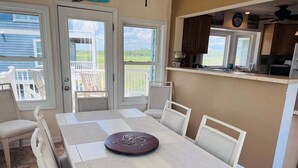 A dining area with a table, chairs, and a decorative centerpiece.