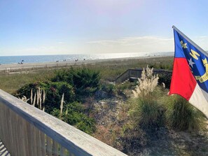 On the beach - Experience bliss at Coast 'N Along, a spacious 3-bedroom retreat in Holden Beach. (Holden Beach)