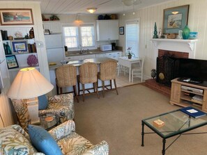 TV - Experience bliss at Coast 'N Along, a spacious 3-bedroom retreat in Holden Beach. (Holden Beach)