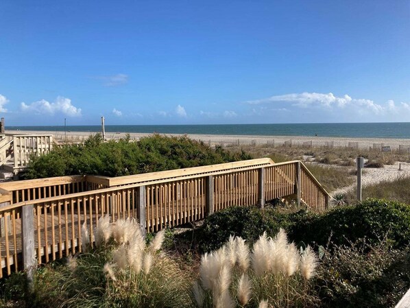 On the beach - Experience bliss at Coast 'N Along, a spacious 3-bedroom retreat in Holden Beach. (Holden Beach)