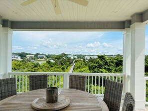 Outdoor dining - Gray Goose is a professionally designed waterway home (Holden Beach)