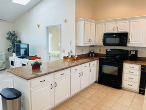 Fridge, microwave, oven, stovetop - Experience oceanfront living at Serenitee - 138B Ocean Blvd E, Holden Beach. (Holden Beach)