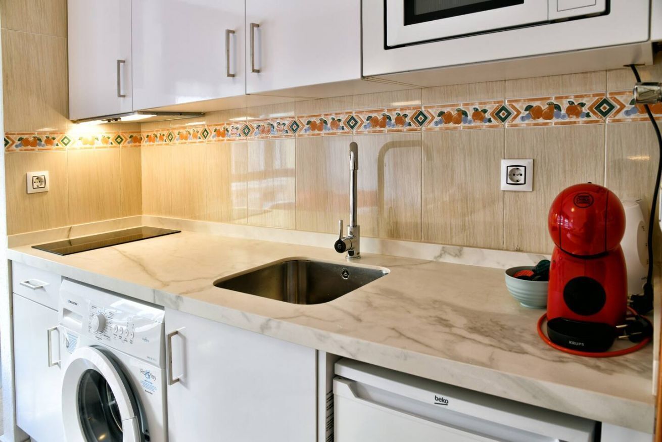 Microwave, stovetop, coffee/tea maker, cookware/dishes/utensils