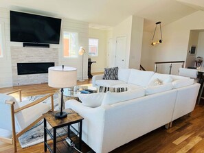 TV - Experience serenity at The Rainbow Connection, a spacious 4-bedroom home near Holden Beach. (Holden Beach)