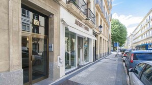 A storefront with a glass facade and a sign reading "ARISTEGU." - Verona | The Rentals Collection (San Sebastián/Donostia)