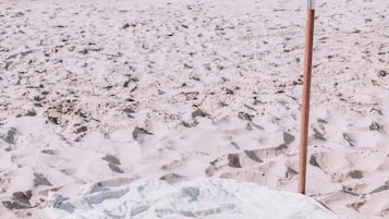 On the beach, sun loungers, beach umbrellas, beach towels