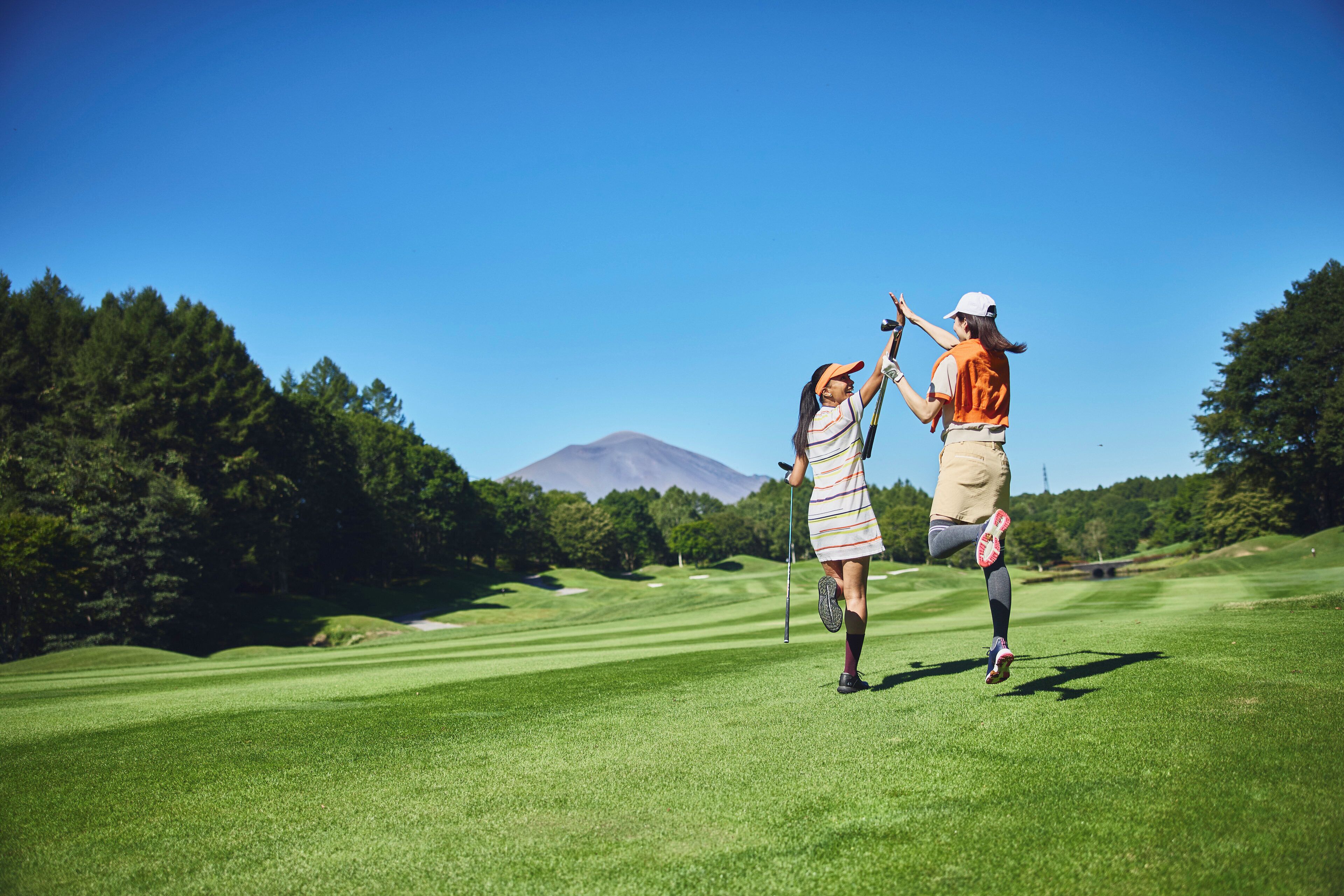 A golf course with a mountain in the background.