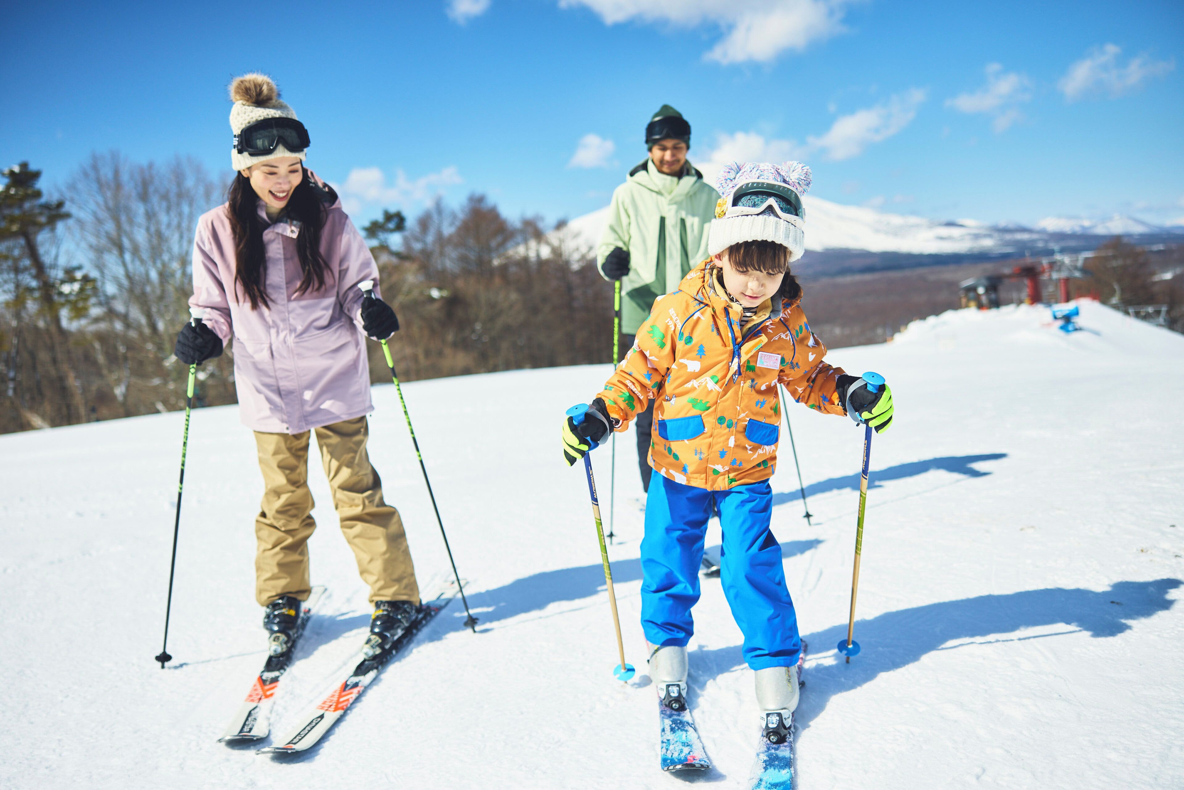 A snowy landscape with skiers.
