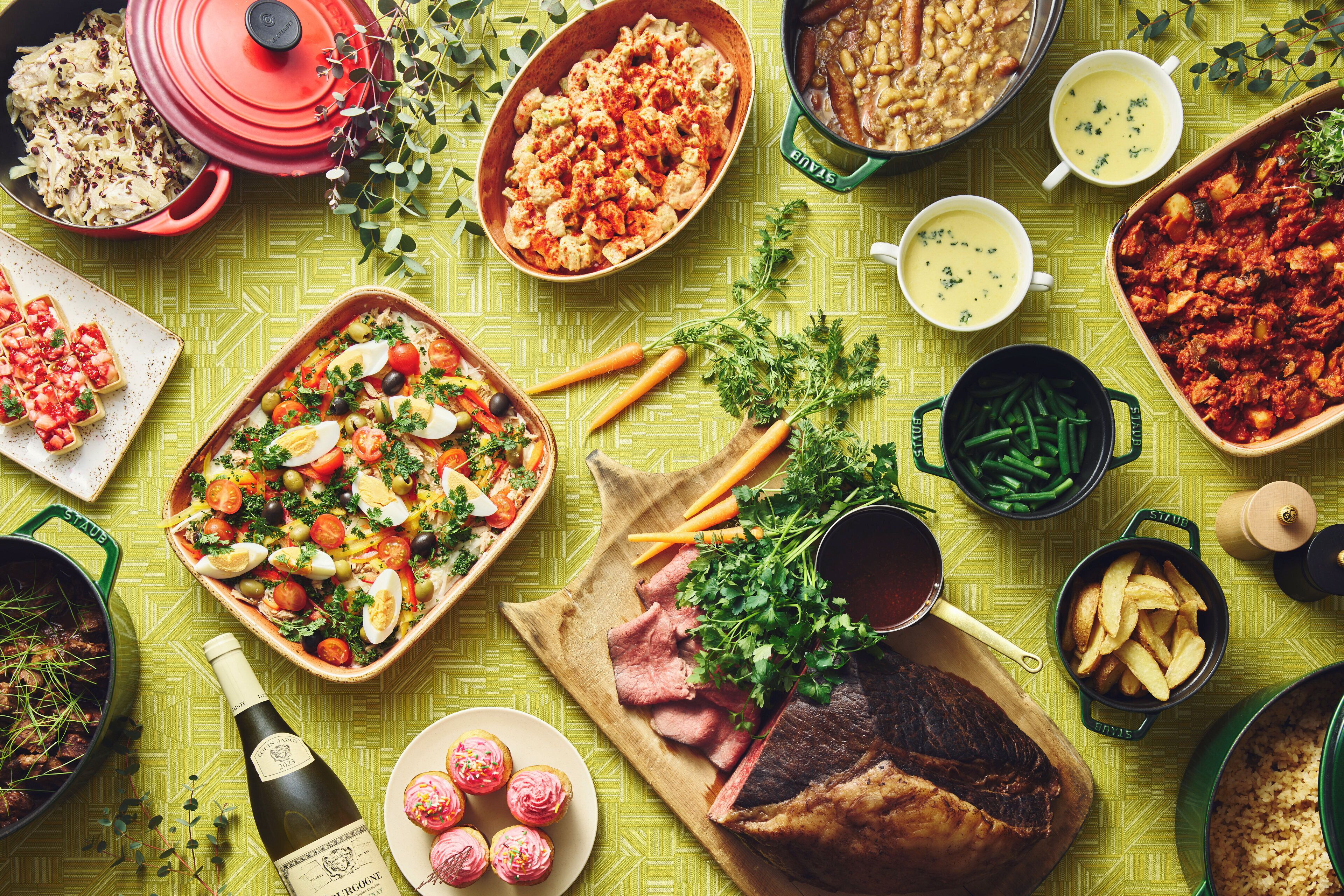 A variety of dishes and food items on a table.
