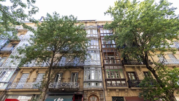 A multi-story building with ornate balconies and large windows. - Urbieta | The Rentals Collection (San Sebastián)