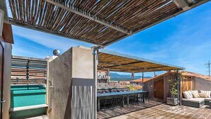 An outdoor patio with a pool, a dining area, and a covered seating area. - Cosy apartment for 4 people with A/C, WIFI, TV and terrace (Porto-vecchio)