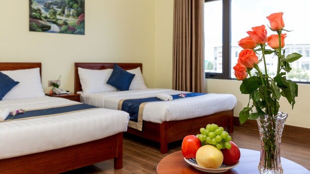 Deluxe Quadruple Room | Minibar, desk, blackout drapes, WiFi (free) - Ga Vang Hotel (Da Nang)