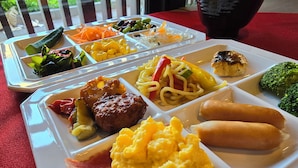A meal tray with various food items including meat, vegetables, and pasta. - Hotel Japanesque Kyoto Station ZEQUU (Kyoto)