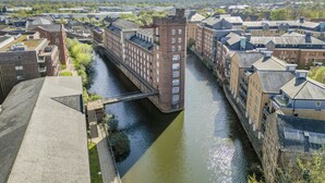 A canal running through a city with buildings on both sides.