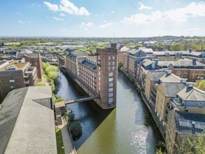 A river running through a city with buildings on both sides.