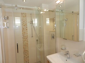 Shower, hair dryer, towels, soap