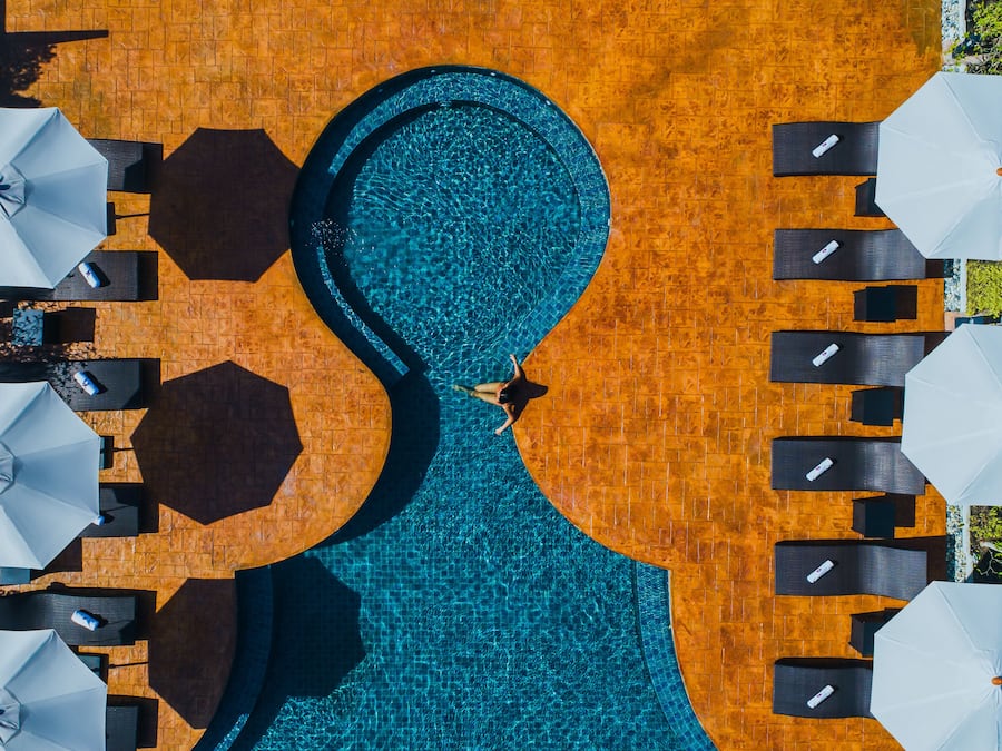 Outdoor pool, open 6:00 AM to 9:00 PM, pool umbrellas, pool loungers