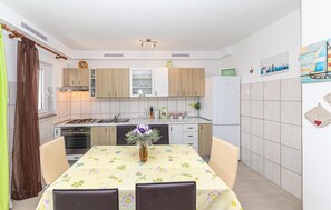 Fridge, stovetop, dishwasher, coffee/tea maker