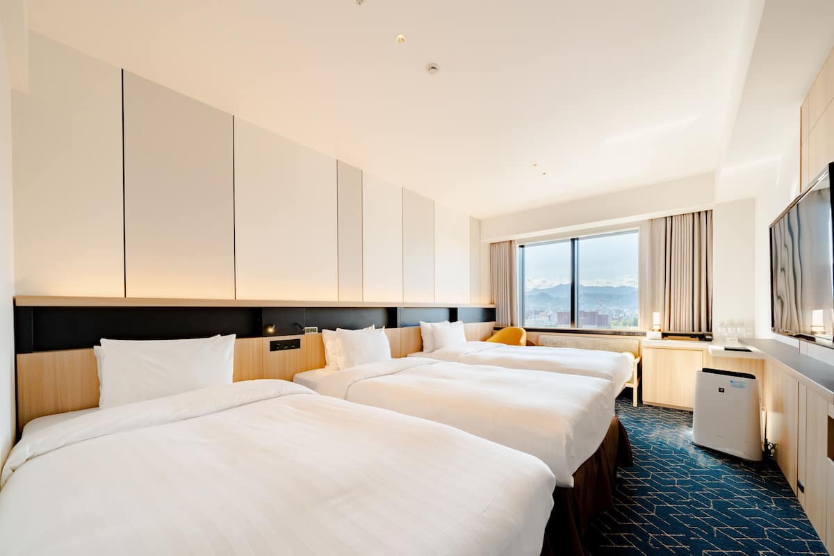 Superior Twin Room for 3 People with Extra Bed - Non-Smoking | 1 bedroom, down comforters, in-room safe, desk