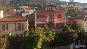 A residential area with houses featuring red-tiled roofs and balconies. - Countryside in town, beautiful beach and all amenities  (Ajaccio)