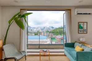 House, City View (Rocamadour) | Living area | 42-inch flat-screen TV with cable channels, TV - Naksan Balcony (Seoul)