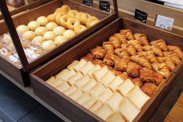 A bakery display case with various baked goods.