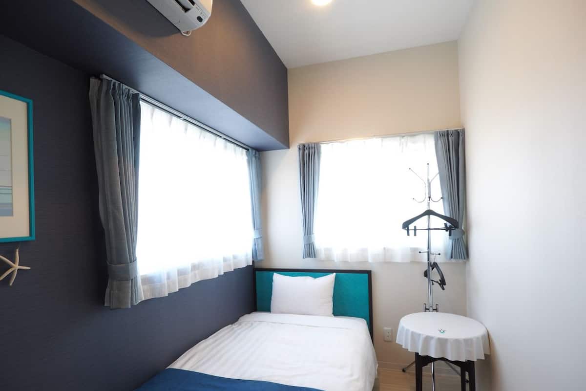Desk, laptop workspace, blackout curtains, free WiFi