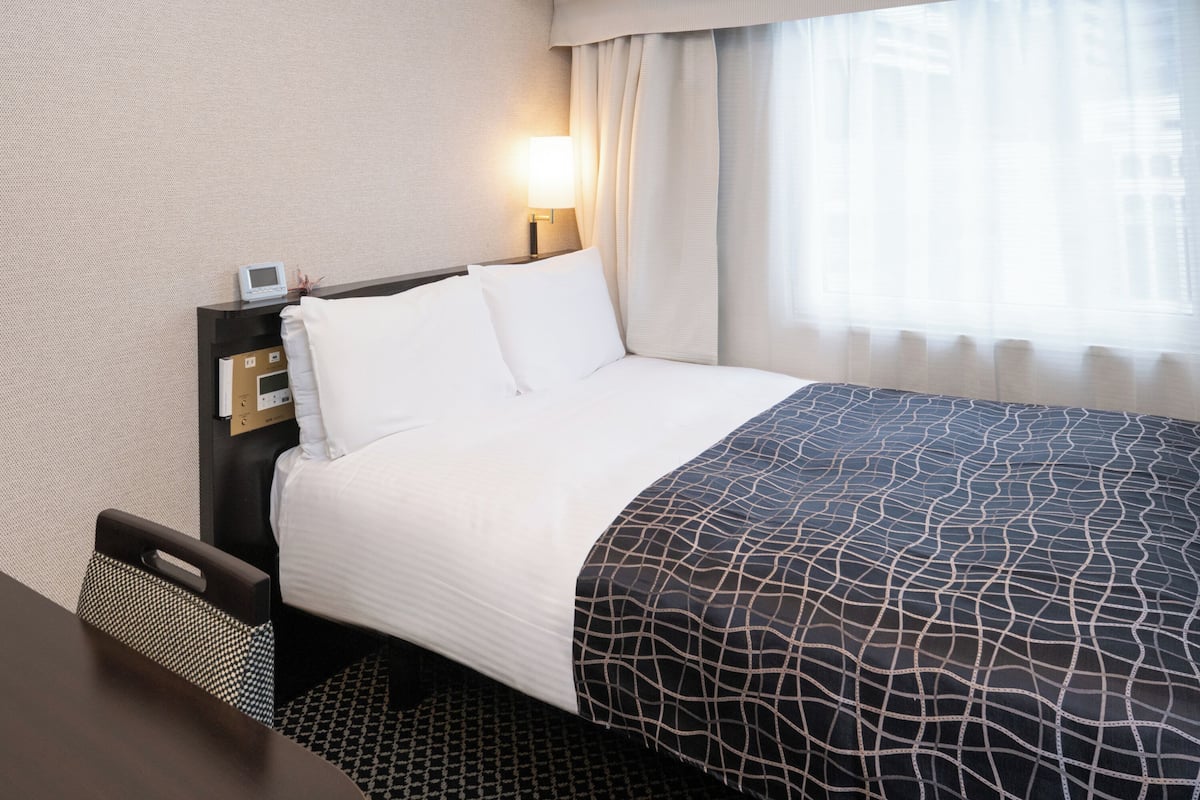 Down duvets, desk, laptop workspace, blackout curtains