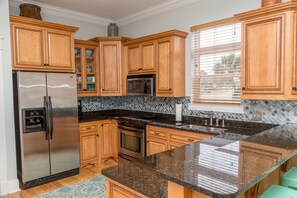 Full-sized fridge, microwave, dishwasher, cookware/dishes/utensils