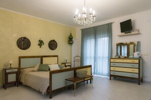 Family Room (Stanza del Paese) | Down comforters, in-room safe, individually decorated