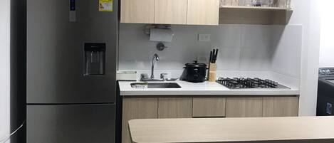 Microwave, coffee/tea maker, cookware/dishes/utensils