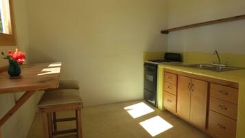 Fridge, stovetop, coffee/tea maker, cookware/dishes/utensils