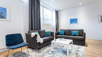 Apartment, 2 Bedrooms (Basement) | Living room | Flat-screen TV