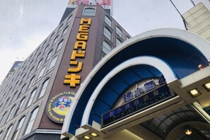 A building with a large sign reading "MEGAQUICK" and a digital display above an entrance. - The Base Sapporo Susukino (Sapporo)